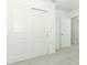 Bright bedroom with carpet, double sliding door closet, and white trim at 7367 Capstone Dr, Groveland, FL 34736