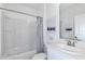 Clean bathroom featuring a shower with tub, white vanity, and modern fixtures at 7392 Capstone Dr, Groveland, FL 34736