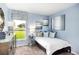 Cozy bedroom with ample natural light, complemented by stylish furnishings and peaceful decor at 7404 Capstone Dr, Groveland, FL 34736