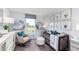 Adorable Bedroom featuring a crib, rocking chair, artwork, and soft lighting at 7404 Capstone Dr, Groveland, FL 34736