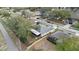Overhead view of the home, yard, and neighborhood street at 839 High Pointe Cir, Minneola, FL 34715