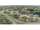 Neighborhood aerial view showcases well-maintained homes and lush landscaping at 839 High Pointe Cir, Minneola, FL 34715