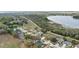 Tranquil community aerial view near the water features attractive homes and lush greenery at 839 High Pointe Cir, Minneola, FL 34715