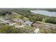 Aerial view featuring manicured lawns and beautiful houses next to the waterfront at 839 High Pointe Cir, Minneola, FL 34715