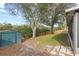 Spacious backyard with mature trees and a storage shed at 839 High Pointe Cir, Minneola, FL 34715