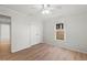 Inviting bedroom with hardwood floors, a ceiling fan, and a spacious closet at 839 High Pointe Cir, Minneola, FL 34715