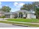 Charming one-story home with well-manicured lawn and a two-car garage at 839 High Pointe Cir, Minneola, FL 34715