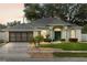 Charming one-story home with well-manicured lawn and a two-car garage at 839 High Pointe Cir, Minneola, FL 34715