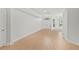 Bright and open living room with wood flooring and white walls at 839 High Pointe Cir, Minneola, FL 34715