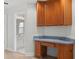 Functional built-in office area with wood cabinets, perfect for a home office setup at 839 High Pointe Cir, Minneola, FL 34715