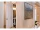 Stylish half-bathroom with decorative wallpaper, pedestal sink, and modern lighting at 8950 Della Scala Cir, Orlando, FL 32836