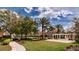 Beautiful community grounds with lush landscaping, walking paths, and cozy seating areas for residents to enjoy at 8950 Della Scala Cir, Orlando, FL 32836