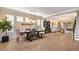 An open-concept dining area with a modern chandelier and neutral decor at 8950 Della Scala Cir, Orlando, FL 32836