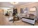 Spacious living room featuring a zebra rug, decorative pillows, and luxury finishes at 8950 Della Scala Cir, Orlando, FL 32836