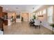 Open concept living space featuring a dining area and kitchen with bar at 8950 Della Scala Cir, Orlando, FL 32836