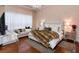 A luxurious main bedroom with a fur blanket and lots of pillows at 8950 Della Scala Cir, Orlando, FL 32836
