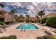 Inviting community pool area with lounge chairs, palm trees, and meticulously maintained landscaping, perfect for relaxation at 8950 Della Scala Cir, Orlando, FL 32836
