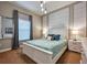 Bright bedroom featuring a plush bed, matching nightstands, and stylish decor for a comfortable retreat at 8962 Sugar Palm Rd, Kissimmee, FL 34747