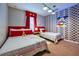 Whimsical bedroom featuring two twin beds, Mickey Mouse decor, and cheerful lighting for a fun atmosphere at 8962 Sugar Palm Rd, Kissimmee, FL 34747