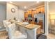 Eat-in kitchen with bar seating, stainless steel appliances, and ample counter space at 8962 Sugar Palm Rd, Kissimmee, FL 34747
