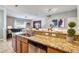 Well-equipped kitchen with granite countertops, wooden cabinets, and stainless steel appliances at 8962 Sugar Palm Rd, Kissimmee, FL 34747