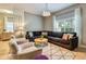 Comfortable living room boasts a large sectional sofa and abundant natural light at 8962 Sugar Palm Rd, Kissimmee, FL 34747