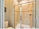 Shower with glass doors and tiled walls, providing a luxurious bathing experience at 8962 Sugar Palm Rd, Kissimmee, FL 34747