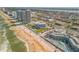 High-rise condos overlooking the beach, adjacent businesses and public parking at 901 S Atlantic Ave # 208, Ormond Beach, FL 32176