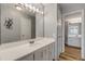 Bright bathroom featuring a large mirror, modern lighting, and a white vanity with updated fixtures at 901 S Atlantic Ave # 208, Ormond Beach, FL 32176