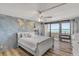 Beach-themed primary bedroom features ocean views, a king bed, and ample white furniture at 901 S Atlantic Ave # 208, Ormond Beach, FL 32176