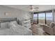 Serene bedroom with a crib, sitting area, and balcony overlooking the ocean; perfect for relaxation at 901 S Atlantic Ave # 208, Ormond Beach, FL 32176