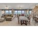 Dining area featuring a large mirror and ocean views through sliding glass doors at 901 S Atlantic Ave # 208, Ormond Beach, FL 32176