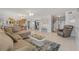 Bright living room features tile flooring, a sectional sofa, and an open floor plan at 901 S Atlantic Ave # 208, Ormond Beach, FL 32176