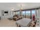 Spacious living room with ocean view and combined dining area at 901 S Atlantic Ave # 208, Ormond Beach, FL 32176