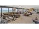 Open living room with ocean views, tile flooring, and a modern sectional sofa at 901 S Atlantic Ave # 208, Ormond Beach, FL 32176