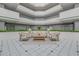 Bright lobby featuring neutral furniture, tiled floors, and plants at 901 S Atlantic Ave # 208, Ormond Beach, FL 32176