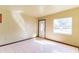 Bright living room with tile flooring, a front door, and a window that provides natural light at 904 Bordeaux Pl, Orlando, FL 32808