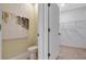 A contemporary half bathroom featuring a toilet, modern art, and a neutral color palette at 907 Princess Sabal Pt, Haines City, FL 33844
