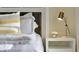 Comfortable bedroom featuring a bedside table with lamp and floral arrangement at 907 Princess Sabal Pt, Haines City, FL 33844