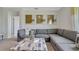 Comfortable living room with a large sectional sofa and view from a bright window at 907 Princess Sabal Pt, Haines City, FL 33844