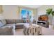 Comfortable living room with a large sectional sofa and view from a bright window at 907 Princess Sabal Pt, Haines City, FL 33844