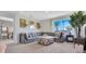 Inviting living room showcasing a comfortable sectional sofa, stylish decor, and abundant natural light at 927 Princess Sabal Pt, Haines City, FL 33844