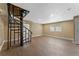 Basement area with wood-look tile and spiral staircase at 10031 Union Park Dr, Orlando, FL 32817