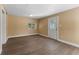 Bright room features wood-look ceramic tile flooring and natural light from the window at 10031 Union Park Dr, Orlando, FL 32817