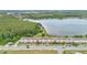 Aerial view of townhomes near a beautiful lake and greenbelt at 10566 Green Ivy Ln, Orlando, FL 32832