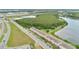 Aerial view of a neighborhood featuring a lake, nature preserve and sidewalks at 10566 Green Ivy Ln, Orlando, FL 32832