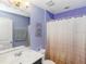 Lovely bathroom featuring colorful walls, shower, and decorative accents at 10566 Green Ivy Ln, Orlando, FL 32832