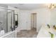 Bright bathroom with a glass-enclosed shower, double sinks, and modern fixtures at 10566 Green Ivy Ln, Orlando, FL 32832