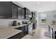 Modern kitchen featuring granite counters, and stainless steel appliances at 10566 Green Ivy Ln, Orlando, FL 32832