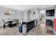 Open concept kitchen with dark wood cabinetry, granite countertop, and stainless steel appliances at 10566 Green Ivy Ln, Orlando, FL 32832
